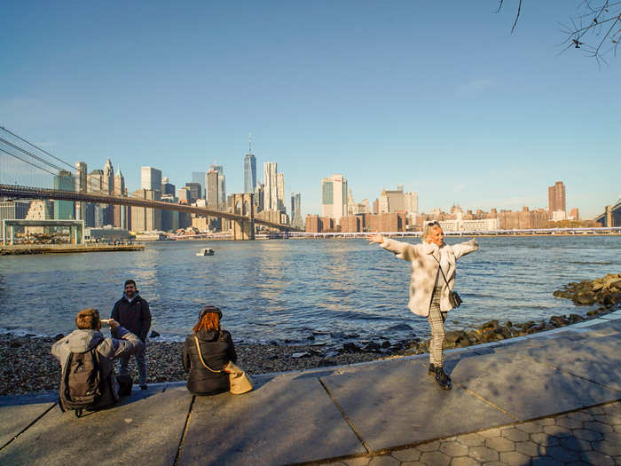 On a Tuesday morning, Brooklyn Bridge Park was filled with tourists posing for photos.