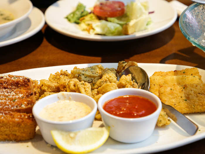 I was immediately intrigued by the sampler ($17.29). The dish comes with a choice of three appetizers. We chose calamari, mozzarella sticks, and lasagna fritta.