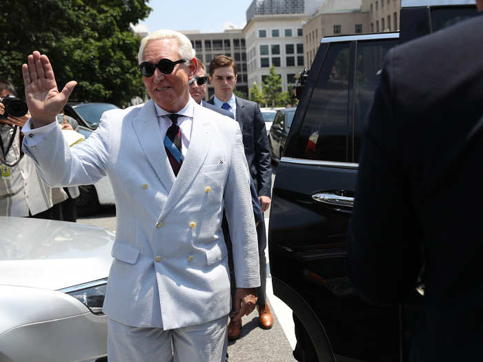 Stone gives a wave as he effortlessly pulls off this light gray suit.