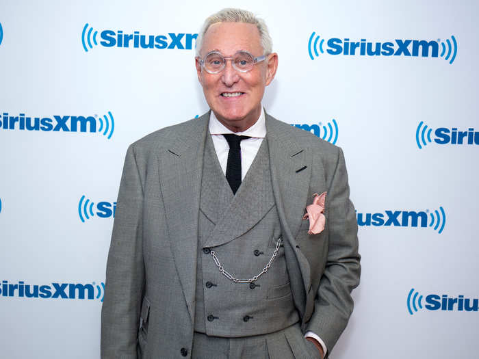 Stone steps out in New York City with new glasses and a pink pocket square.