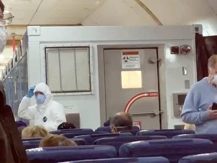 Fourteen US citizens who tested positive for the virus flew home in an isolation box on the back of the plane with other Americans from the ship.