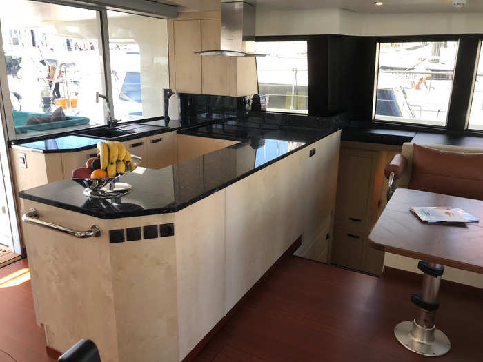 The pantry includes a kitchen with cabinets for storage, a sink, and a cooktop.