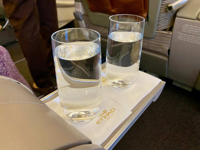 A flight attendant came by and offered us drinks as everyone boarded. We just asked for water.