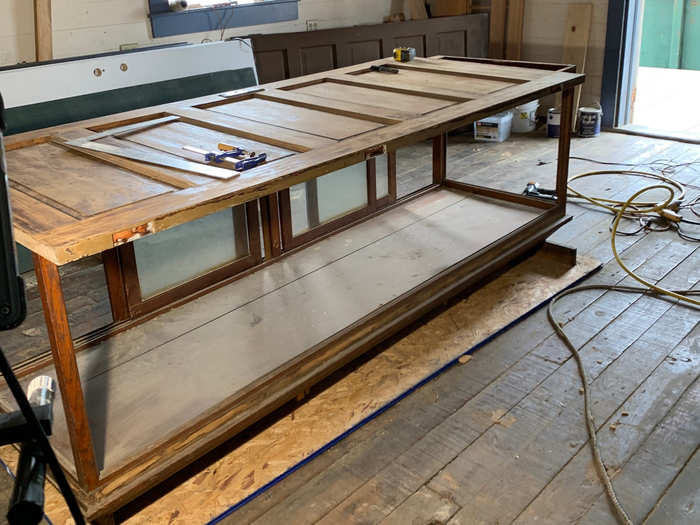 The couple also wrapped an original display case with two antique doors to make an island for their new kitchen.