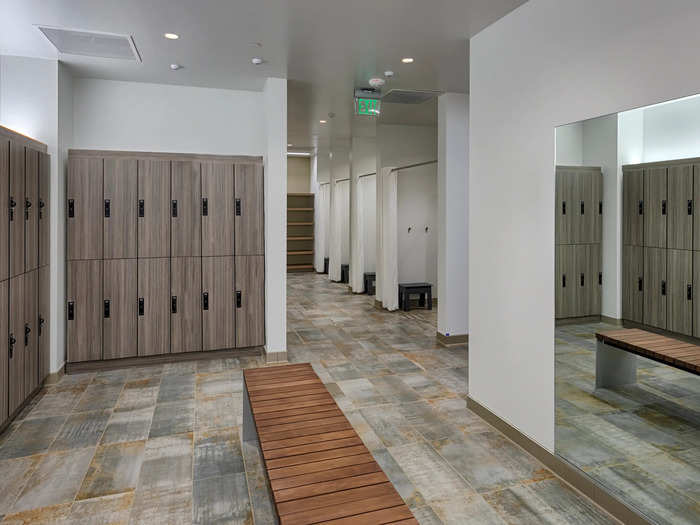 The locker room is sleek and modern.