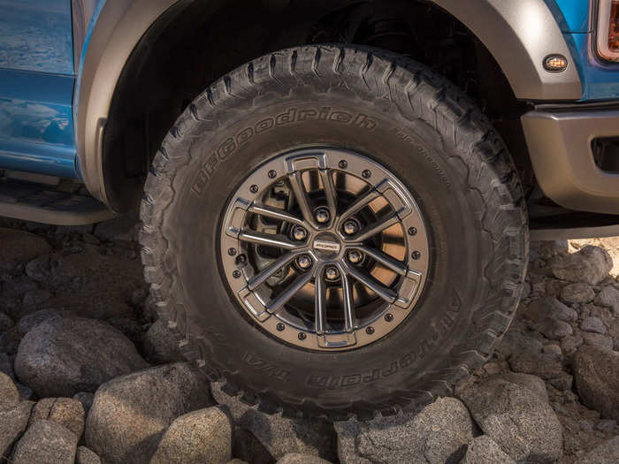 ... and 17-inch aluminum wheels wrapped in massive, knobby, all-terrain tires.