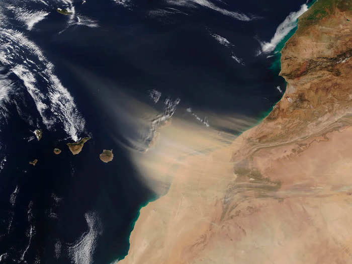 Winds up to 75 mph blew in a massive sand cloud from the Saharan desert, which is about 62 miles away. The sand storm, as it crossed the Atlantic Ocean, was so large it could be seen from space.