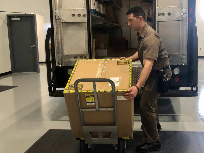 Students also learn how to safely manage heavy loads. UPS fills boxes with bags of sand to weigh them down, and students practice carrying the loads out of the back of a truck ...