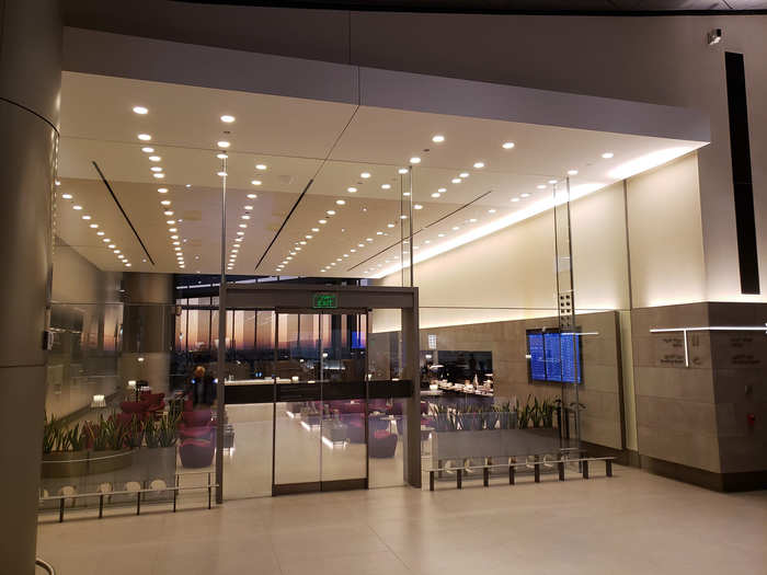 One of the separate lounge areas faces the runway. Below is a photo of the dedicated business center lounge, which had plenty of potted greenery and contemporary chairs and tables.