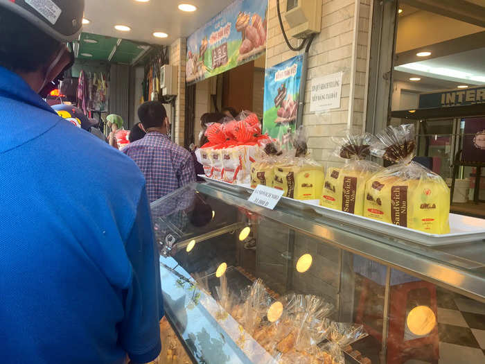 Cashiers swiftly handed off bags filled with fives loaves in exchange for 30,000 Vietnamese dong, or about $1.30.