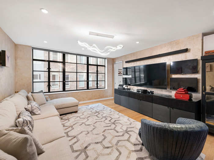 The spacious condo boasts 10-foot-high ceilings and a private balcony.