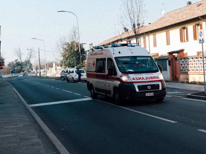 Traffic is light. This single ambulance drove down an empty street.