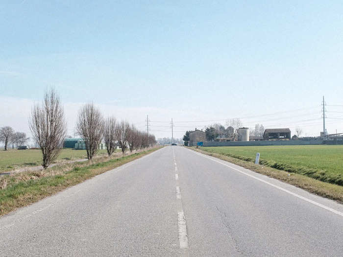 This road into town looks empty, but far in the distance, military police are standing guard. Anyone who attempts to leave without permission could go to prison for three months, or be fined about $223.