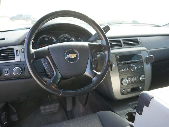 The kitchen — which can be accessed from both inside and outside the Suburban — has a sink, refrigerator, and freezer. The refrigerator can be reached from the driver