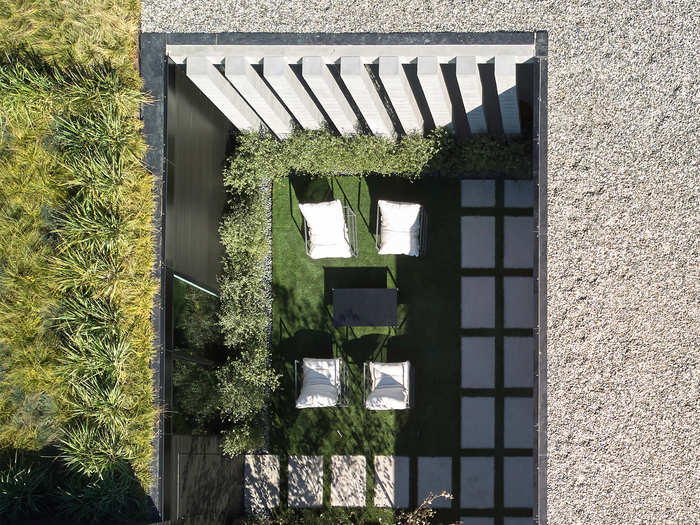 The enclosed courtyard, seen here, separated the main house from the garage and guest unit.