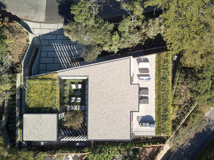 The house is a series of terraces that fit into the shape of the hill, with a green roof and vegetation that "reclaim the hill," the architect told Business Insider.