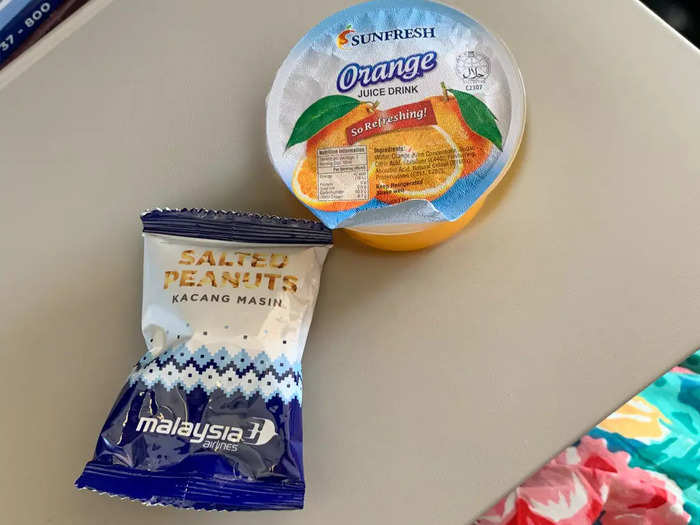 The plane was only in the air for about 45 minutes, but flight attendants still found time to distribute peanuts and juice. The orange juice was much easier to open than the water on my previous flight.