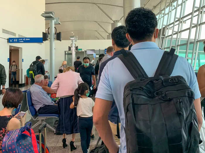 As I waited to board, a flight attendant circulated the area, asking passengers if they had recently visited China, Hong Kong, or Cambodia.