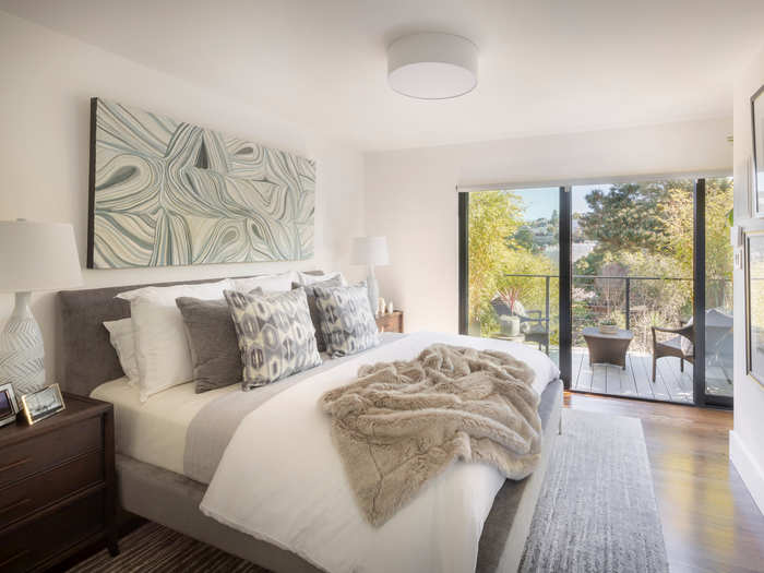 The master bedroom has two closets, plus glass doors open to a bamboo-lined terrace.