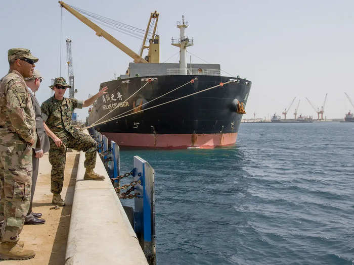 Personnel from Naval Supply Systems Command Fleet Logistics Center Bahrain traveled to Duqm to help offload cargo, including 6,000 pounds of mail and flu vaccines for the Normandy. They also found lost baggage for a service member who traveled commercially to meet the Truman.