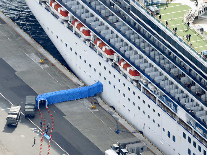 A few people — less than 10 — from the Diamond Princess ship did not leave Travis Air Force Base on Monday with the rest of the group. The CDC did not explain why, but Fehrenbacher thinks they had to start their quarantines over.