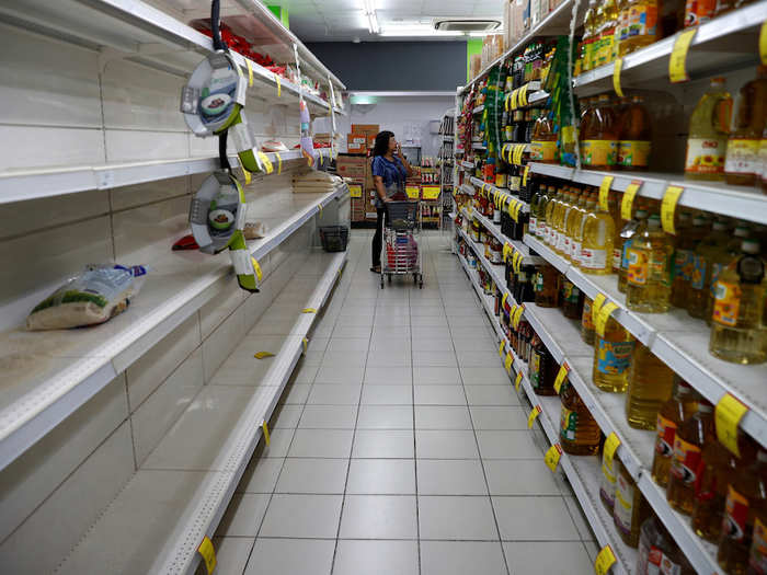 ...while the local authorities urged residents not to panic, supermarkets shelves were stripped bare.