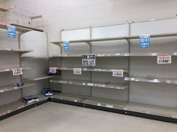 Just a few lonely packs of toilet paper remained in the Fujisawa grocery store on Sunday.