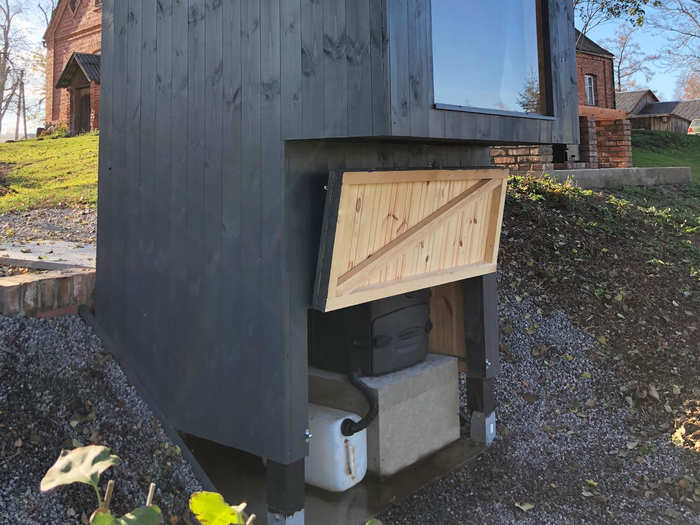 Composting material from the toilet is removed periodically.