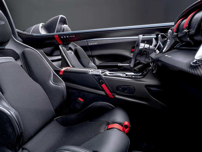 In place of a regular glovebox, the V12 Speedster gets a removable leather bag fastened to the dash.