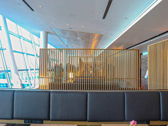 Wooden walls divide sections in the lounge but were made see-through to promote a more open concept.