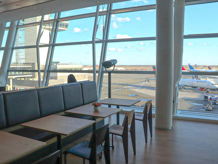 Spanning nearly the length of the lounge, the dining area provides the best views of the adjacent Terminal 4 tarmac...