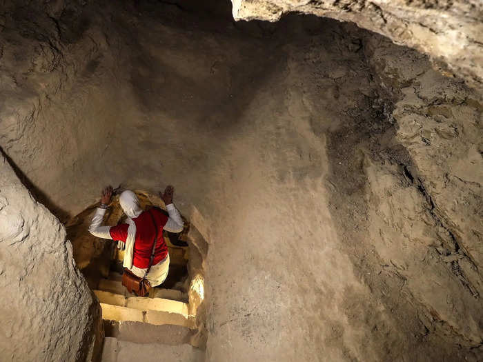 This woman gripped the roof as she descended deeper into the ground.