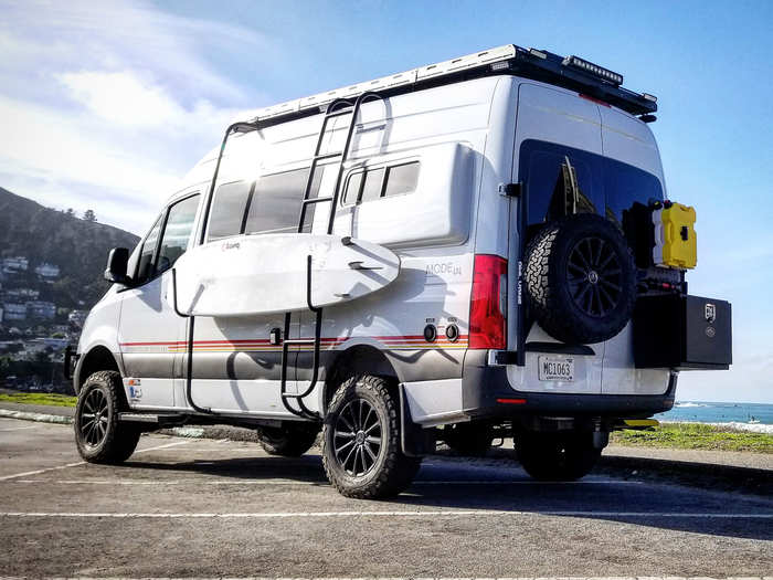 Exterior storage includes a surfboard rack, spare tire carrier, and swing hinge rack system with a lockable gearbox. The rack system can store items such as field gear and extra diesel or freshwater packs.