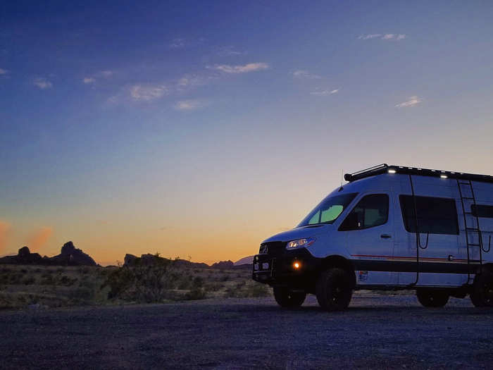 Fiberglass flares are used to expand the width, and therefore the interior space, of the camper van.