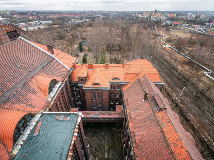 Parts of the roof have been renewed to prevent further damage from happening. In the background is the skyline from the city Katowice.