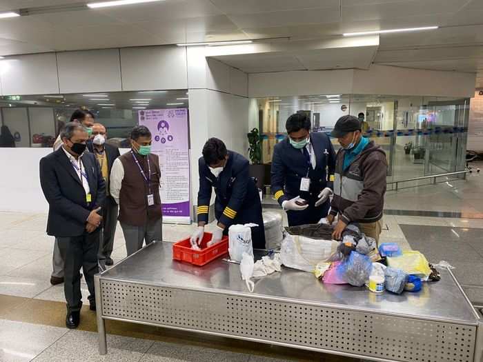 Airport employees have been advised to wear masks and gloves to reduce the risk of infection — even those at customs who oversee suspicious baggage.