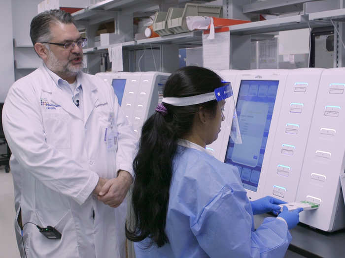 From there, the cartridge is fed into an ePlex machine, where the sample undergoes around 20 different chemical reactions to test for the virus.