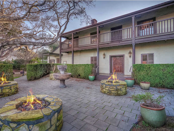 ...with outdoor space for dining or entertaining guests, including four fire pits.