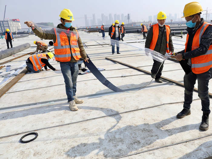 China built new hospitals in a rush, with workers toiling night and day to get them done.