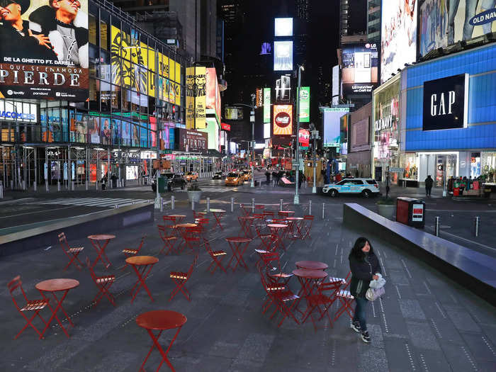 AFTER: There would have been no trouble finding a seat at the red tables on March 16. Other than a lone woman walking by, they were empty, along with the rest of Time Square.