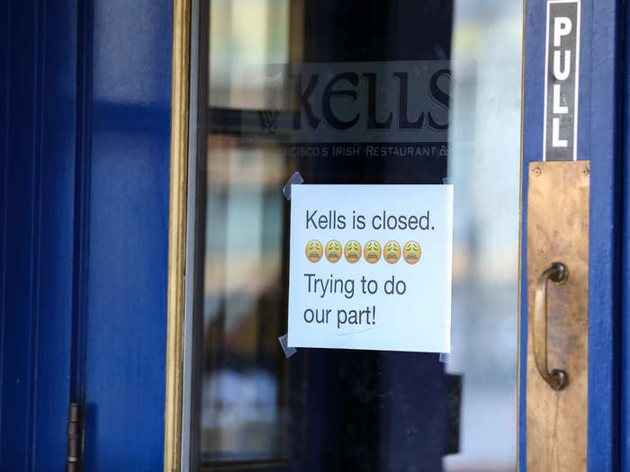 A sign was taped to the window indicating that the bar and restaurant was closed. It read: "Trying to do our part!"