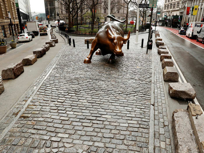 The "Charging Bull" statue stands quiet in the Financial District neighborhood as pedestrian traffic continues to be slower to prevent rampant transmission of the coronavirus disease (COVID-19) in New York, U.S., March 17, 2020.