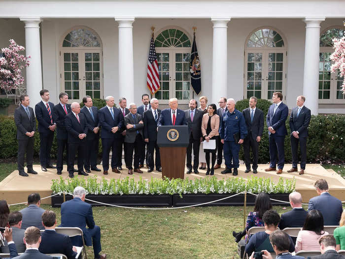 On March 13, Trump held a press conference with 18 people packed closely behind him.