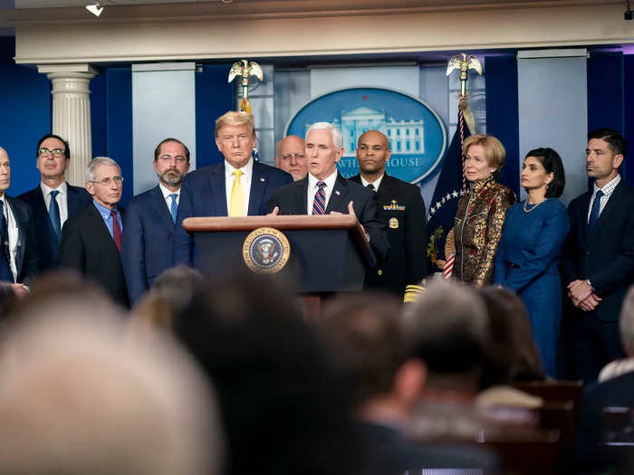 On March 9, 10 other people stood shoulder-to-shoulder with Trump and Pence as they addressed the media on the coronavirus spread. That same day, Trump downplayed the virus by blaming Democrats and saying the flu was more dangerous.