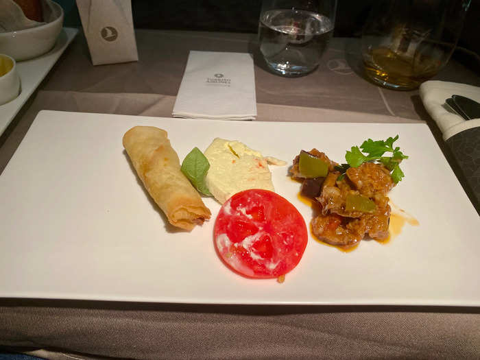 Dinner service began about an hour after takeoff, with a selection of starters ...