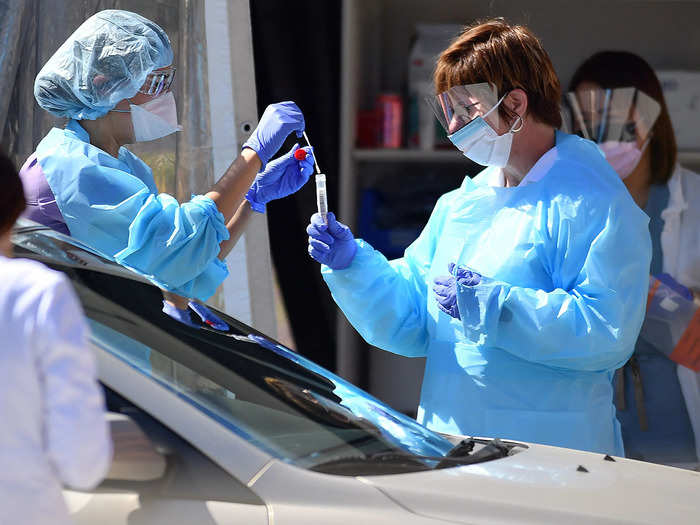 Workers then place the swab in a sterile container.