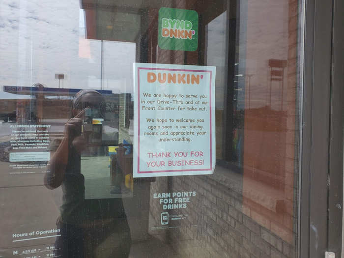 We stopped at a Dunkin outside Wisconsin Dells for a pick-me-up, and they had signs referencing the pandemic like everyone else. They were offering take-out and drive-thru service, but no seating.