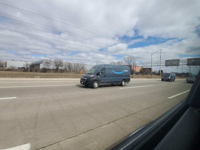 We spotted a fleet of Amazon delivery vans heading west on I-90 outside Chicago. The company is hiring 100,000 new roles to keep up with the demand for delivering essential goods for the coronavirus pandemic.