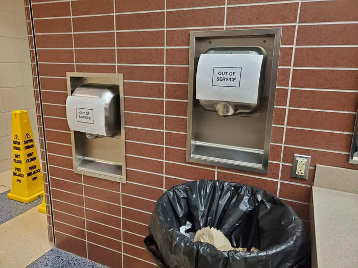 The hand dryers in the bathrooms had signs saying they were out of service, too. A hygiene expert told Insider