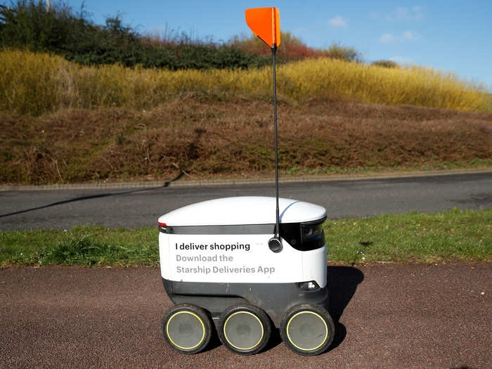 A self-driving Starship robot drops off deliveries in Emerson Valley, Britain.